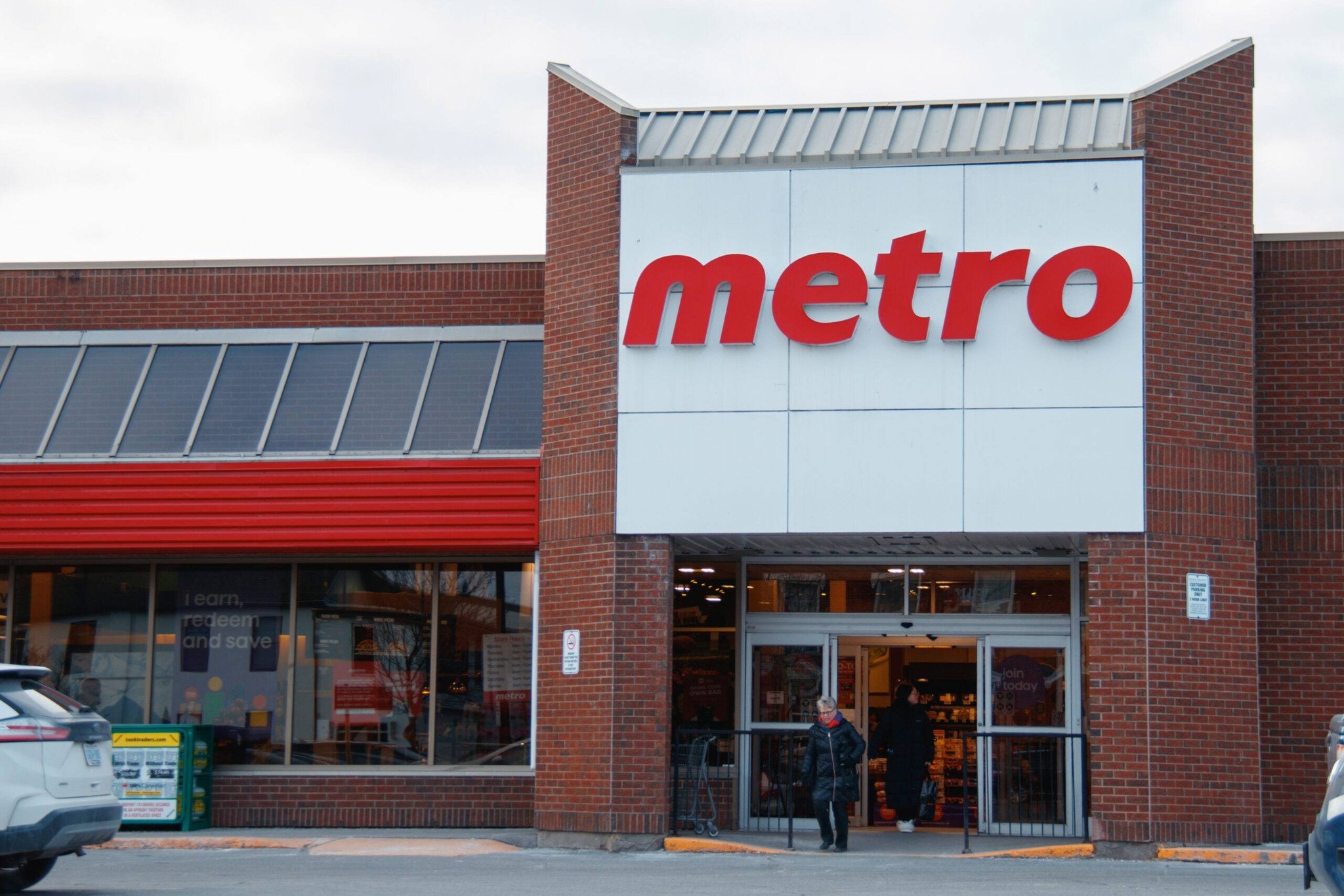 10 - The Canada Times Brick storefront with a large white panel bearing the red 'metro' logo above the entrance.