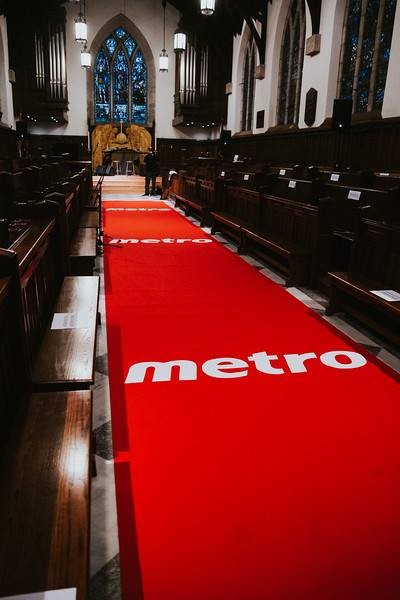 5 - The Canada Times Red carpet runs down the church aisle, with the word 'metro' printed on it.