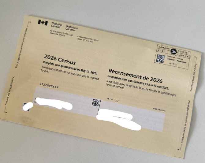 12 - The Canada Times Canada 2026 Census questionnaire form on a light surface, bilingual title '2026 Census / Recensement de 2026' with a barcode area and masked personal fields.