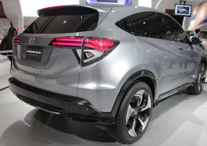 3 - The Canada Times Rear three-quarter view of a silver Honda Urban SUV Concept on a showroom floor, with red taillights visible and large alloy wheels.