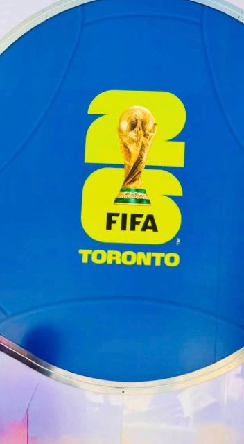 5 - The Canada Times Blue banner featuring a yellow FIFA logo with the World Cup trophy and the word TORONTO at the bottom.